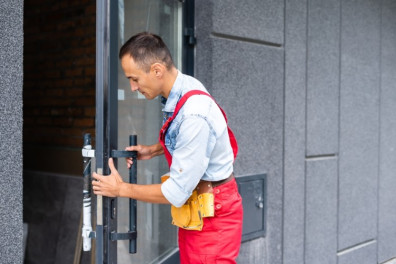Locksmith fixing door lock