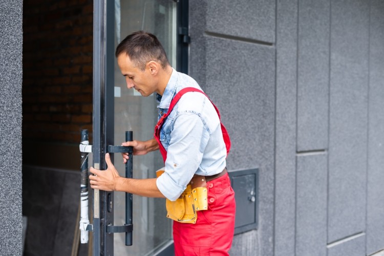 Locksmith fixing door lock